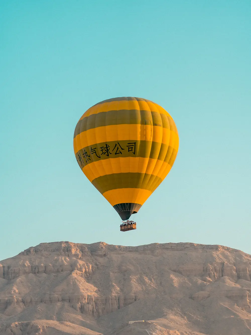 Hot air balloon flying in the desert