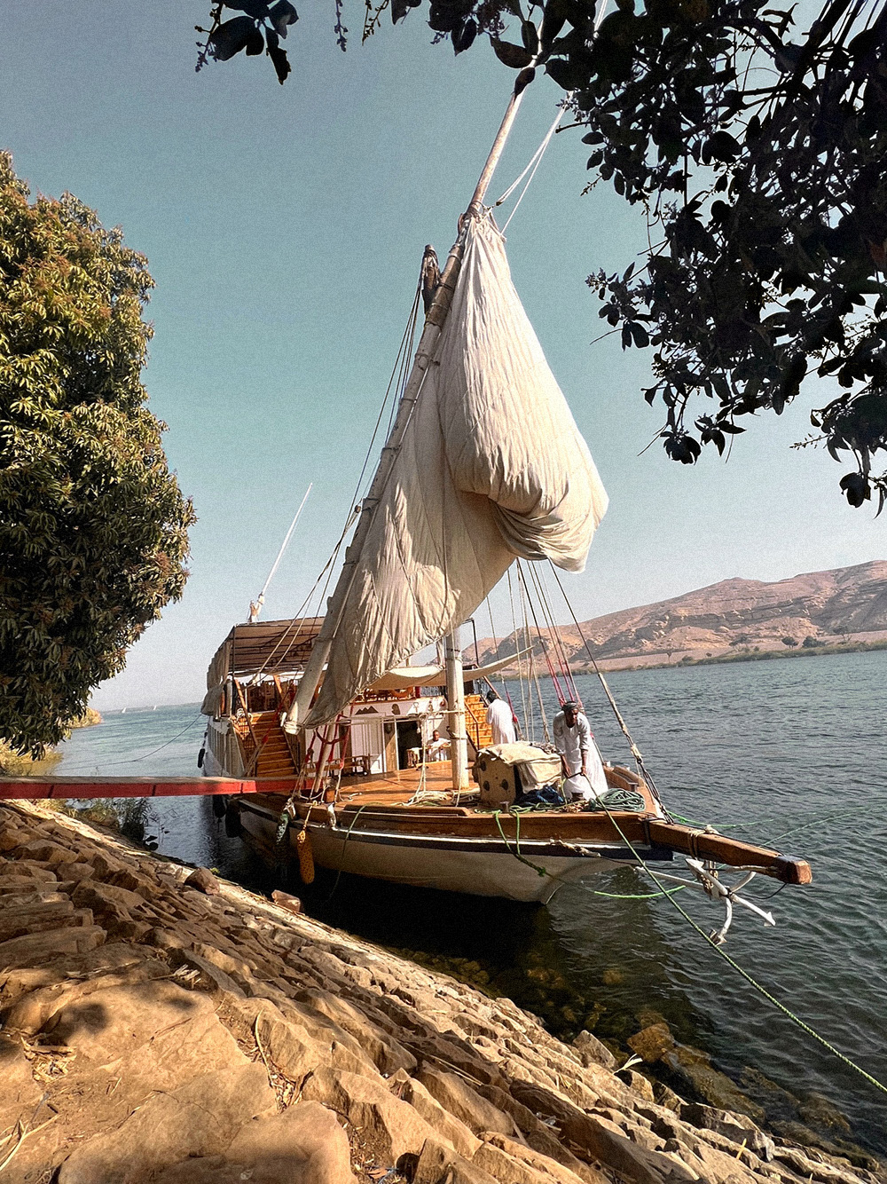 Dahabiya is the iconic wooden boat of the Nile with its white sails